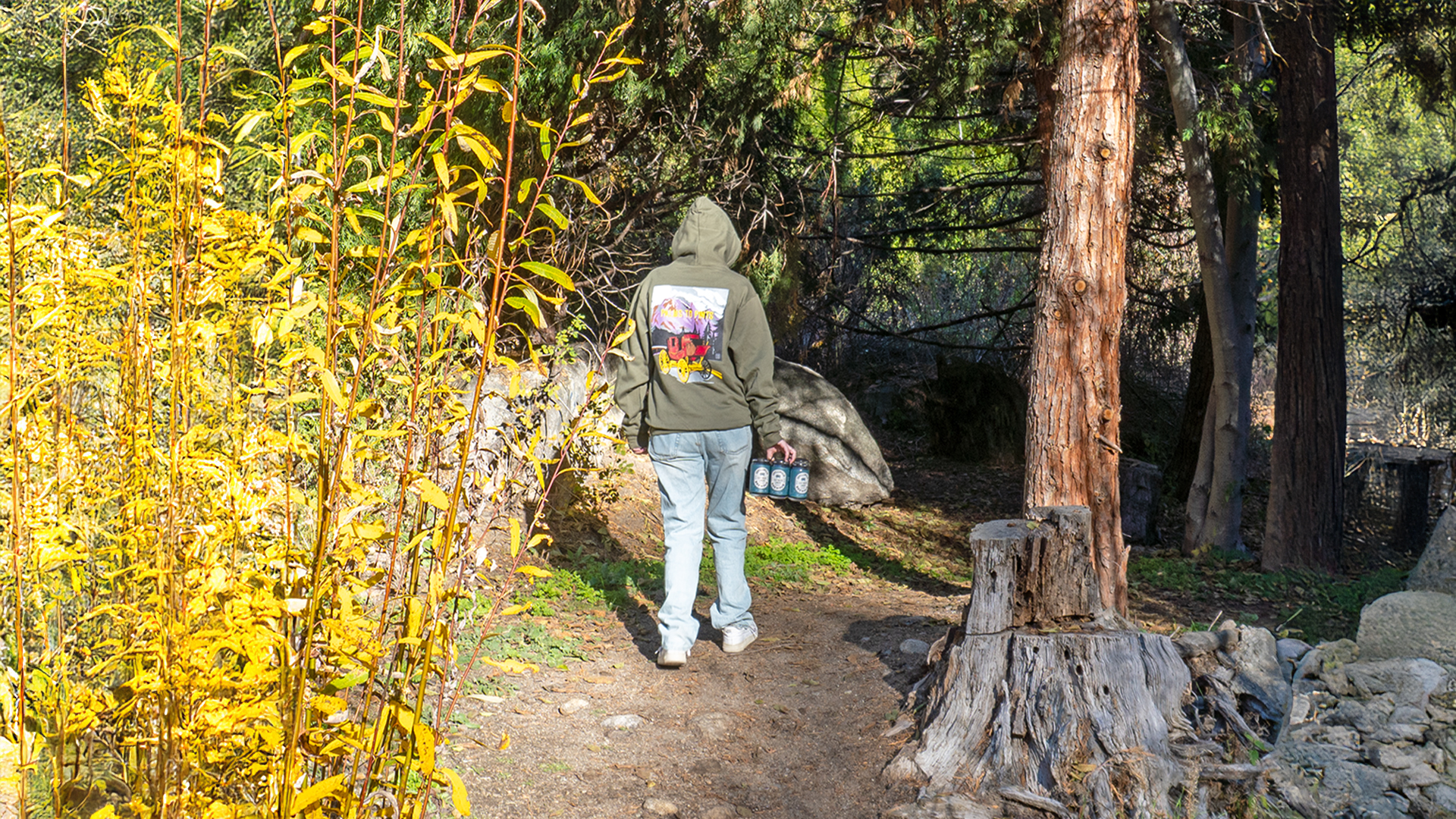 A visitor to Idyllwild explores the local trails with a six pack of local Idyllwild Brewpub Lily Rock Lager beer