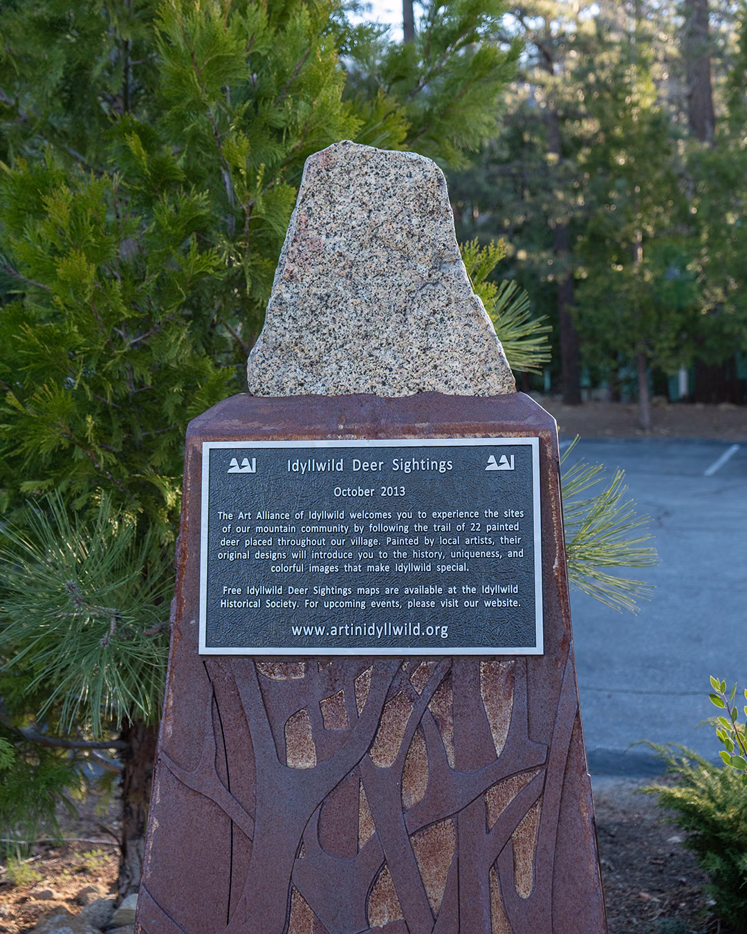 Idyllwild Deer Sightings plaque, dated October 2013, on a stone and steel marker