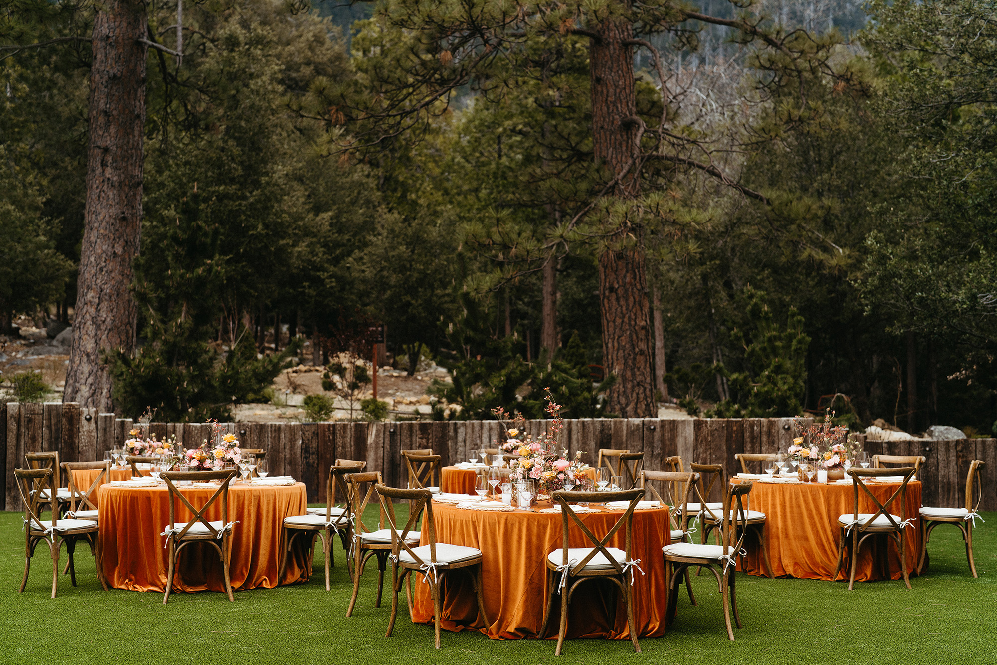 Tables on the event lawn at Tahquitz Pines Retreat